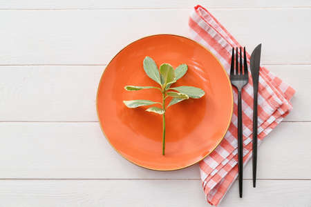Simple table setting on white wooden backgroundの写真素材