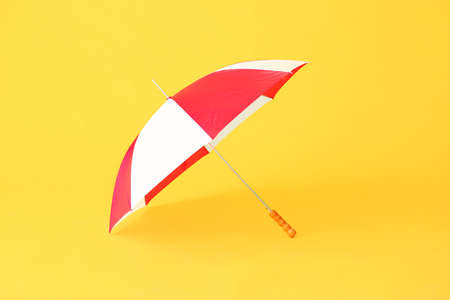 Stylish umbrella on color backgroundの写真素材
