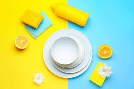 Composition with clean dishes on color background