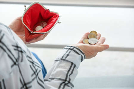 Senior woman counting money at home, closeupの写真素材