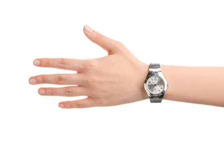 Female hand with stylish wrist watch on white backgroundの写真素材