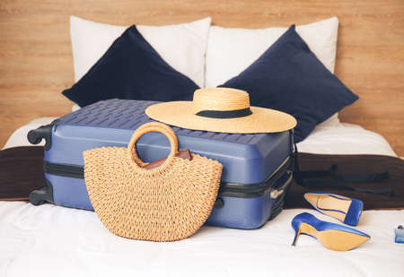 Packed suitcase on bed. Travel conceptの写真素材