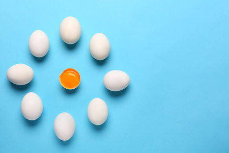 Fresh chicken eggs on color backgroundの写真素材