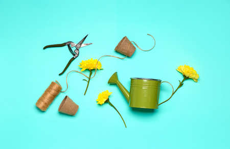 Set of gardening supplies on color backgroundの写真素材
