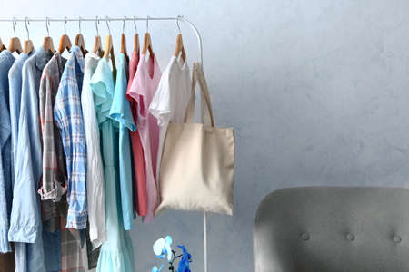 Hanger with clothes and eco bag in dressing roomの写真素材