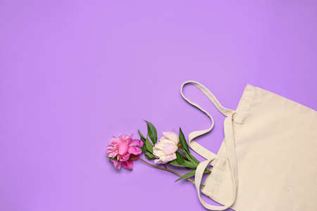 Eco bag with flowers on color backgroundの写真素材