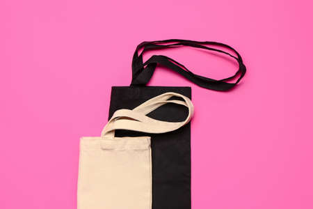 Eco bags on color background