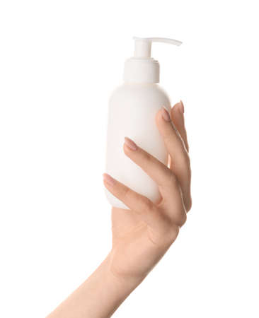 Hand of young woman with cream on white backgroundの写真素材