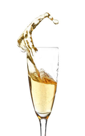 Glass of champagne with splash on white backgroundの写真素材