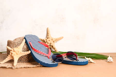 Set of beach accessories on light background
