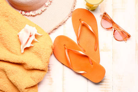 Set of beach accessories on wooden backgroundの写真素材