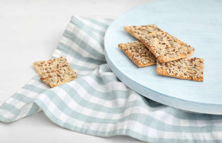 Board with cereal cookies on table