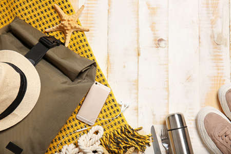 Set of traveler's accessories on wooden backgroundの写真素材