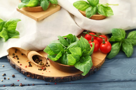 Composition with fresh basil on wooden backgroundの写真素材