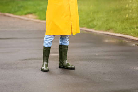 Young man wearing raincoat outdoorsの写真素材