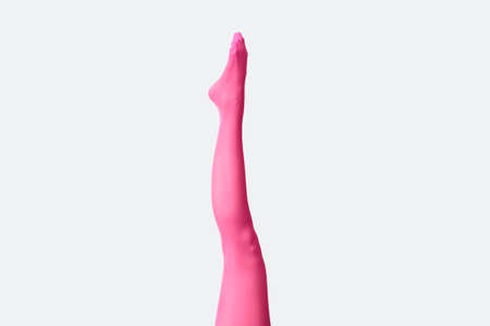 Beautiful young woman in tights on light backgroundの写真素材