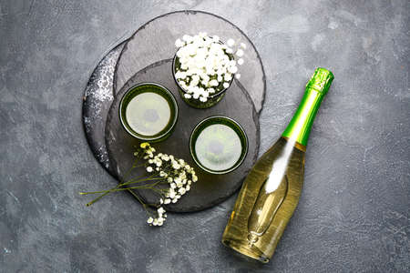 Composition with bottle of champagne on gray backgroundの写真素材