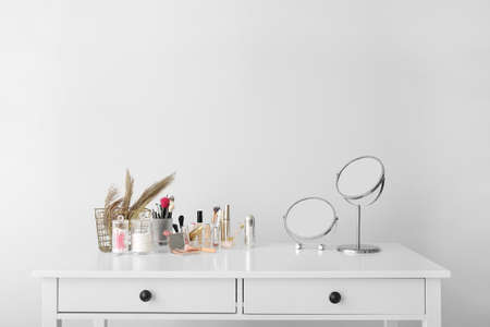 Set of decorative cosmetics and mirrors on dressing tableの写真素材