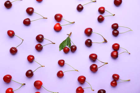 Ripe sweet cherry on color background
