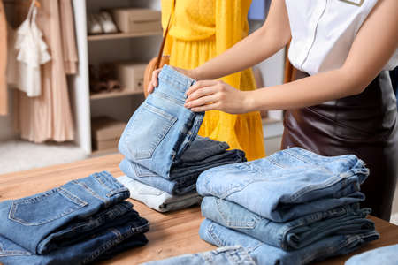 Female seller in modern clothes storeの写真素材