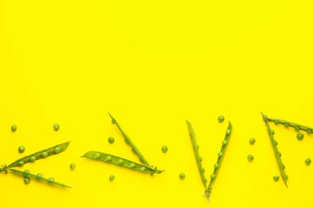 Tasty fresh peas on color backgroundの写真素材
