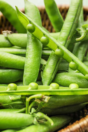 Basket with tasty fresh peas, closeupの写真素材