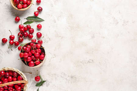 Composition with sweet cherry on light background