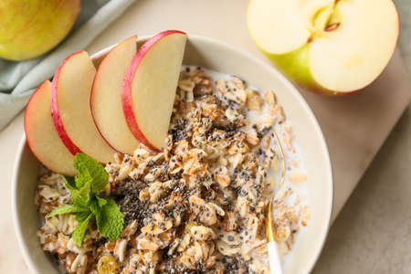 Bowl with tasty sweet oatmeal on table, closeupの写真素材
