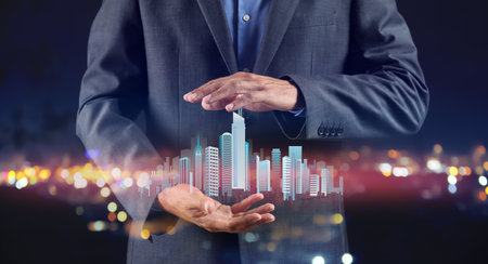 Real estate agent with digital projection of buildings at night city
