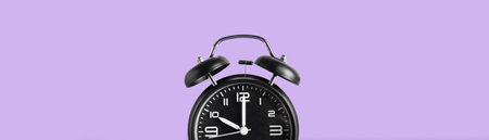 Alarm clock on color background with space for text