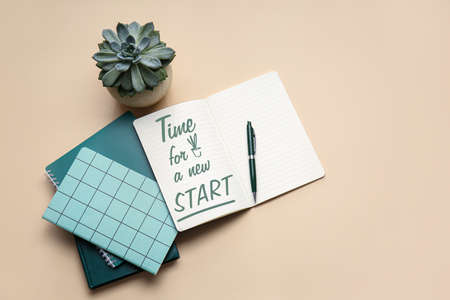 Notebooks with text TIME FOR A NEW START on color backgroundの写真素材