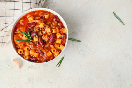 Bowl with tasty pasta and beans on white backgroundの写真素材