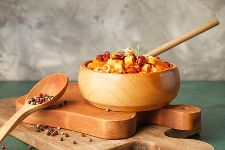 Bowl with tasty pasta and beans on tableの写真素材