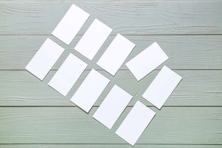 Blank business cards on wooden background