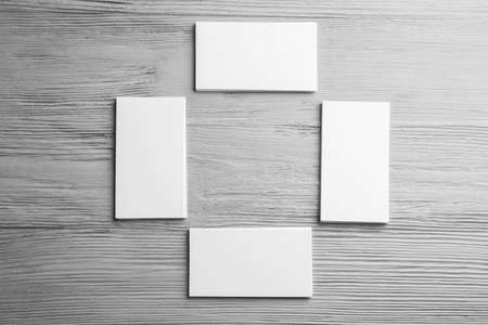 Blank business cards on wooden backgroundの写真素材