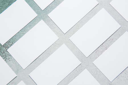 Blank business cards on color background