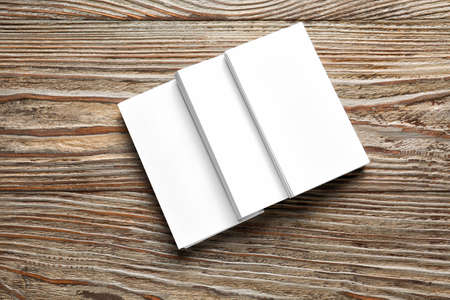 Blank business cards on wooden background