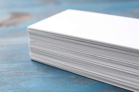 Blank business cards on wooden background, closeup
