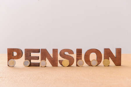 Word PENSION with coins on tableの写真素材