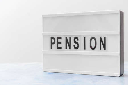 Board with word PENSION on light backgroundの写真素材