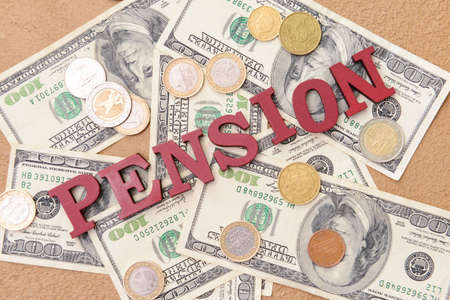 Money with word PENSION on color backgroundの写真素材