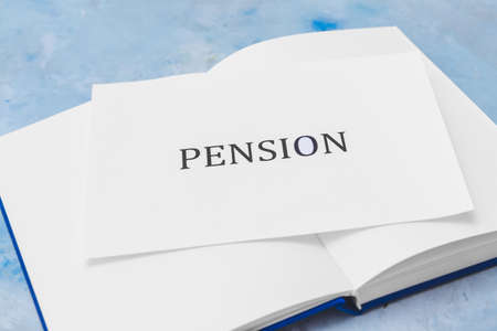 Book with word PENSION on color background, closeupの写真素材