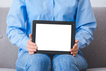 Woman with modern tablet computer at home