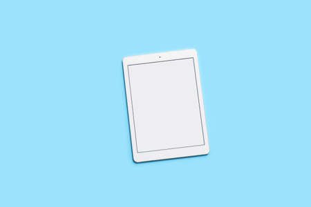 Modern tablet computer on color background