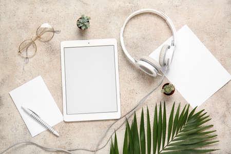 Composition with modern tablet computer on light background