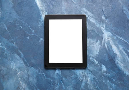 Modern tablet computer on color backgroundの写真素材