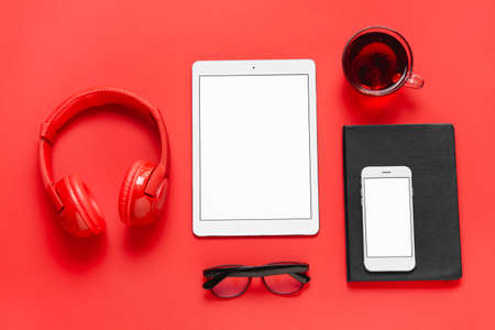 Composition with modern tablet computer on color backgroundの写真素材