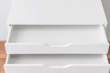 Empty chest of drawers in roomの写真素材