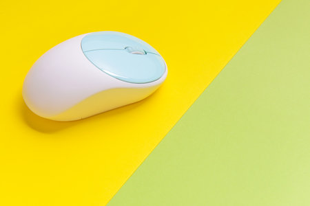 Modern computer mouse on color backgroundの写真素材