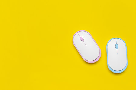 Modern computer mouse devices on color backgroundの写真素材